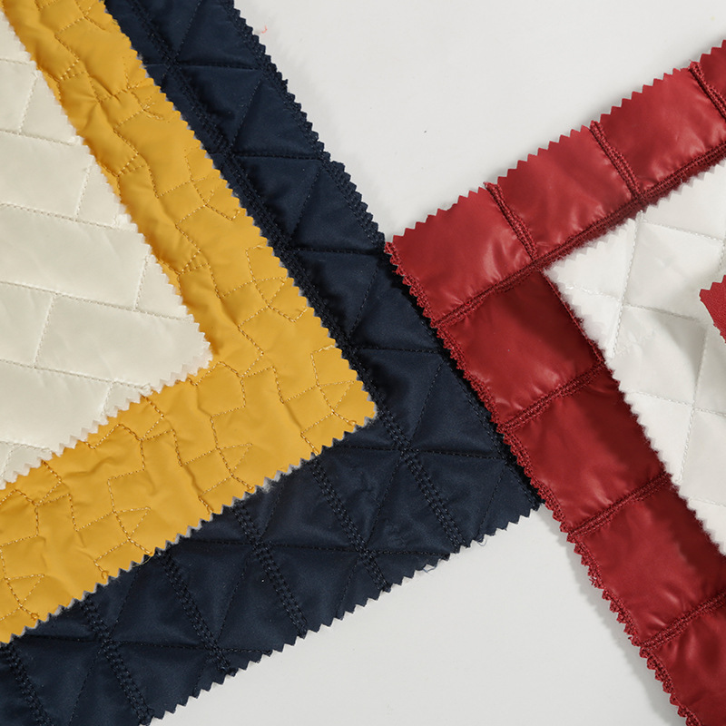 厂家直供菱形格绗绣绗缝面料批发 防水双层棉袄时装刺绣布料