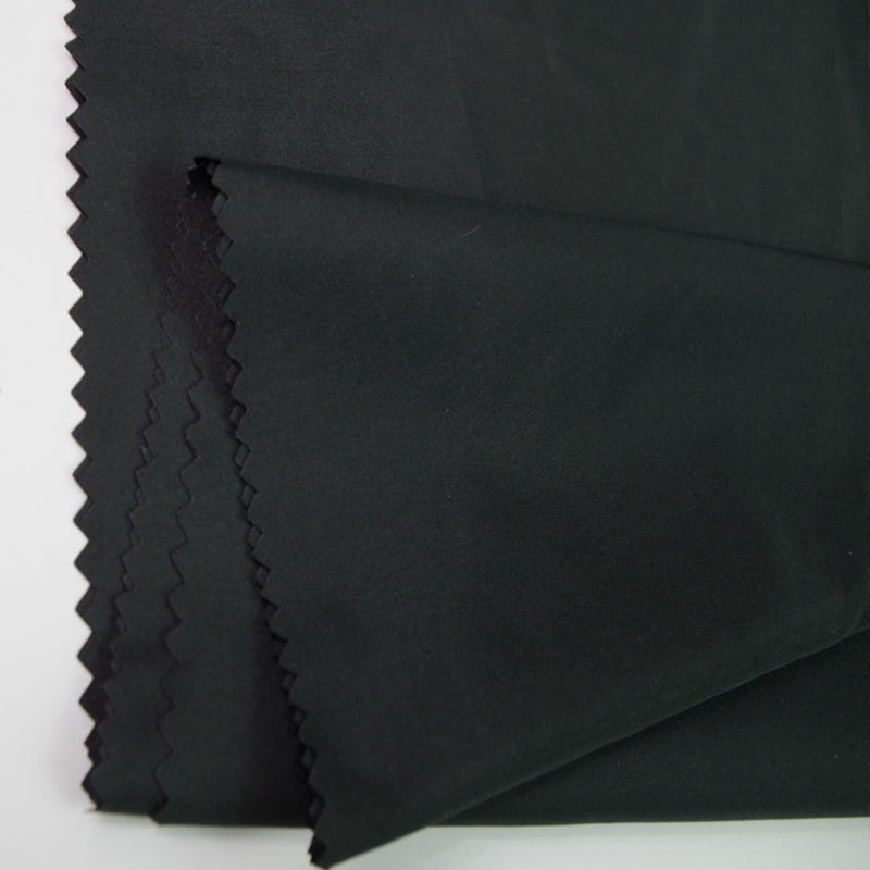 供应全涤素色春亚纺面料 风衣夹克休闲羽绒服西装里衬布料