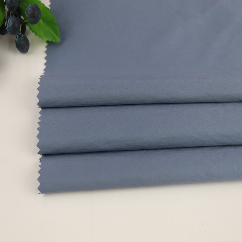 平纹威尼斯风衣面料 棉服羽绒服裤装时装面料 秋冬涤纶面料 现货