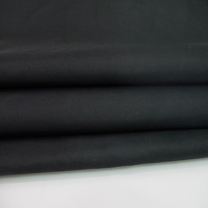 供应全涤素色春亚纺面料 风衣夹克休闲羽绒服西装里衬布料