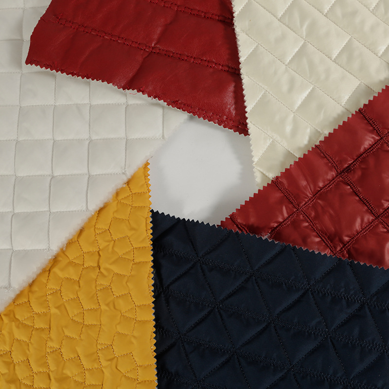 厂家直供菱形格绗绣绗缝面料批发 防水双层棉袄时装刺绣布料