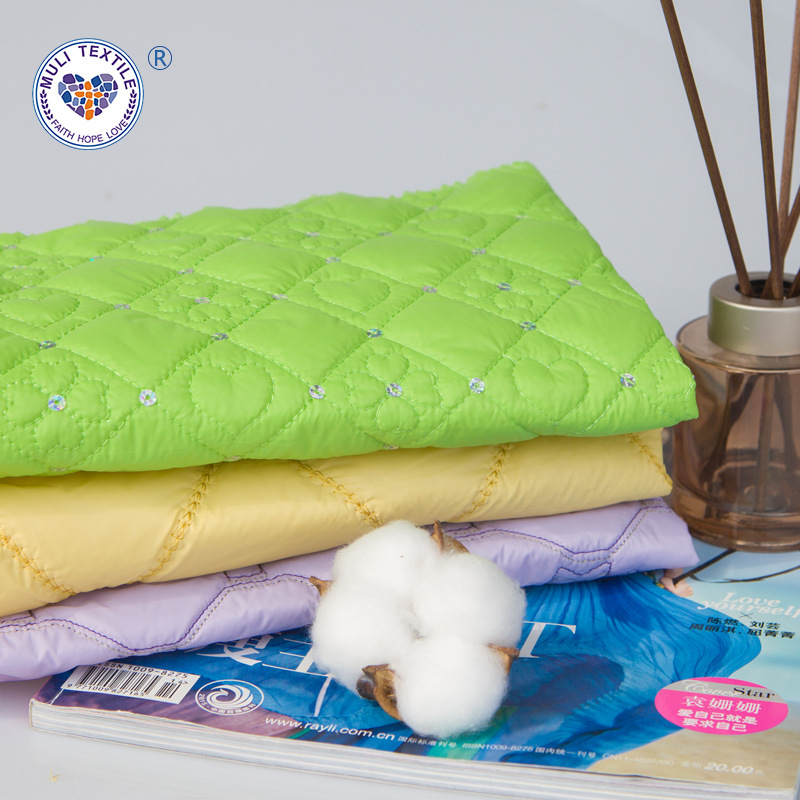 亮片夹棉绗缝布料 棉服刺绣面料电脑绣花厂 羽绒服面料绗绣批发