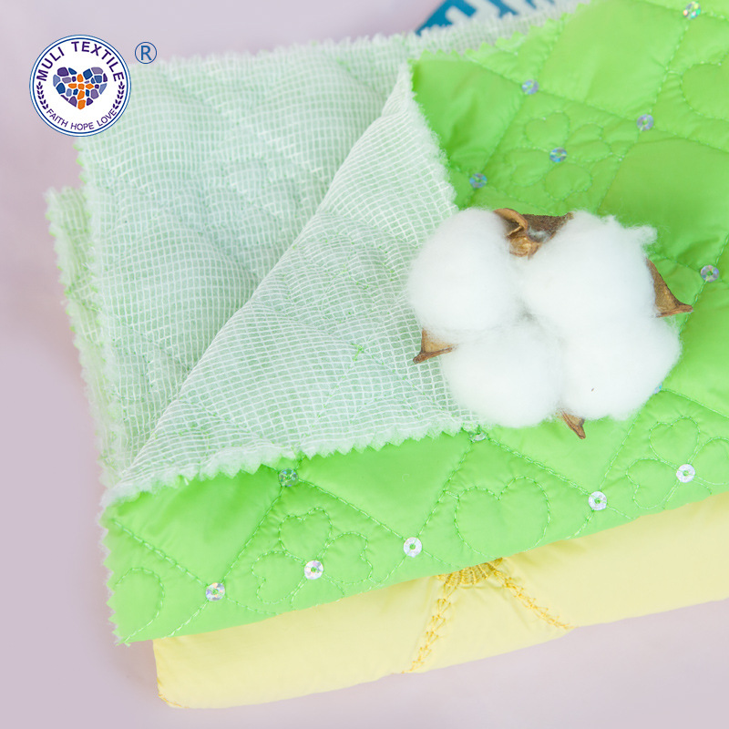 亮片夹棉绗缝布料 棉服刺绣面料电脑绣花厂 羽绒服面料绗绣批发