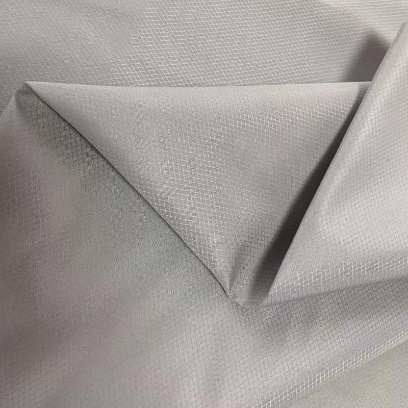 现货150G全涤平纹小蜂巢PU涂层复合针织布校服冲锋衣面料